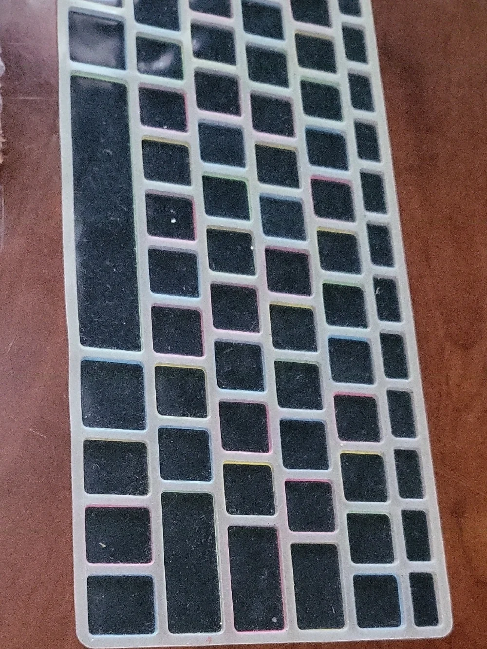 silicone keyboard cover for MacBook Pro and Air features a black layout with lar